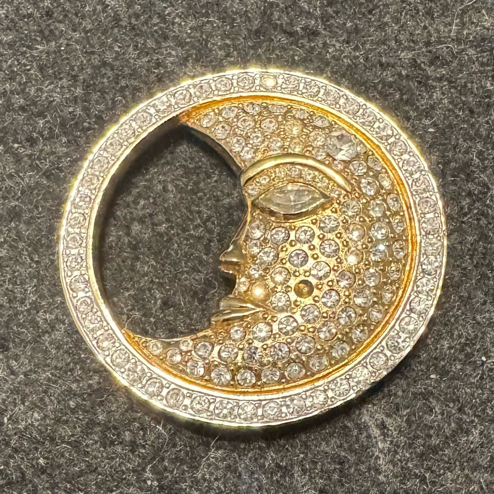 Vintage Carolee features a "man in the moon" crescent face.